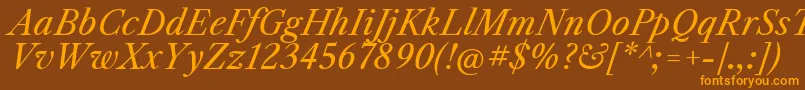 フォントLibrecaslontextItalic – オレンジ色の文字が茶色の背景にあります。