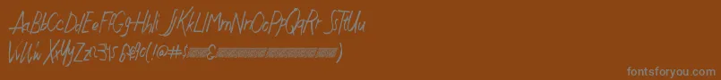 Шрифт Justwritedt – серые шрифты на коричневом фоне