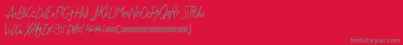 Justwritedt-Schriftart – Graue Schriften auf rotem Hintergrund