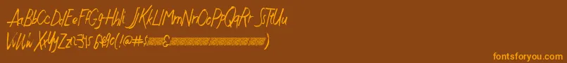 Czcionka Justwritedt – pomarańczowe czcionki na brązowym tle