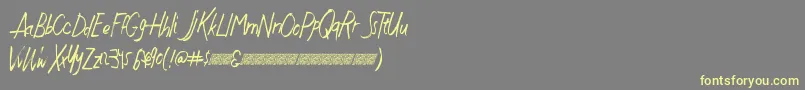 Justwritedt-Schriftart – Gelbe Schriften auf grauem Hintergrund