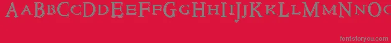 Fonte NewstyletitlingEmbossed – fontes cinzas em um fundo vermelho