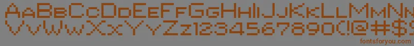 Czcionka Pixgothic7shareware – brązowe czcionki na szarym tle