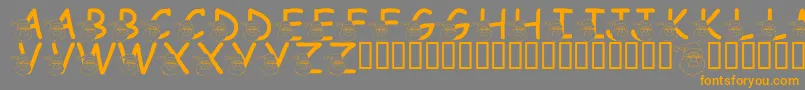 フォントLmsSaintNick – オレンジの文字は灰色の背景にあります。
