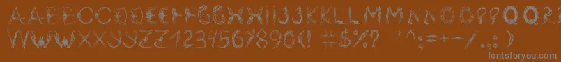 フォントInsektofobiya – 茶色の背景に灰色の文字