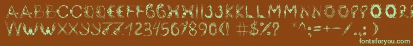 フォントInsektofobiya – 緑色の文字が茶色の背景にあります。