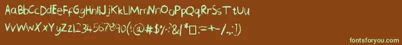 フォントChequeredPencilCrayons – 緑色の文字が茶色の背景にあります。
