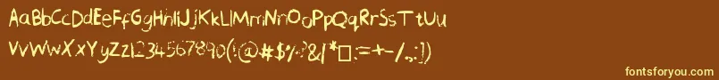 ChequeredPencilCrayons-fontti – keltaiset fontit ruskealla taustalla