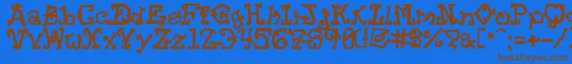 フォントStrtvc – 茶色の文字が青い背景にあります。