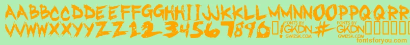 フォントGwizskRegular – オレンジの文字が緑の背景にあります。