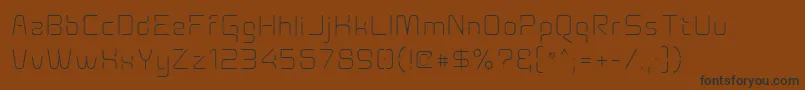Fonte Aunchantedxspacethin – fontes pretas em um fundo marrom