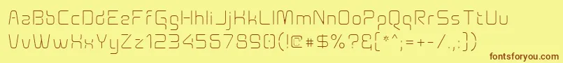 フォントAunchantedxspacethin – 茶色の文字が黄色の背景にあります。