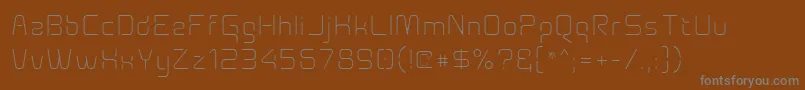 Aunchantedxspacethin Font – Gray Fonts on Brown Background