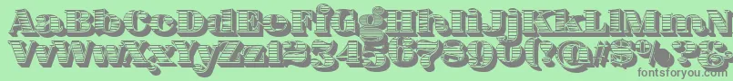 FatFlamingo5WoodcutBlack-fontti – harmaat kirjasimet vihreällä taustalla