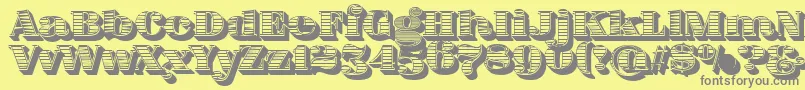 FatFlamingo5WoodcutBlack-fontti – harmaat kirjasimet keltaisella taustalla