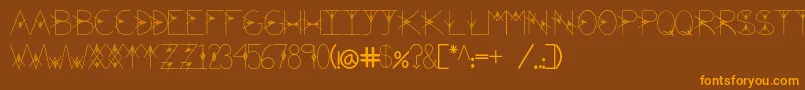 フォントTheValley – オレンジ色の文字が茶色の背景にあります。