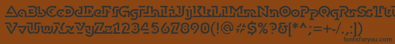 フォントDublonbrusc – 黒い文字が茶色の背景にあります