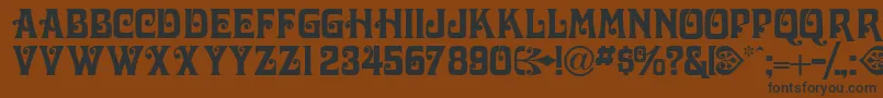 Volutecapsssk Font – Black Fonts on Brown Background