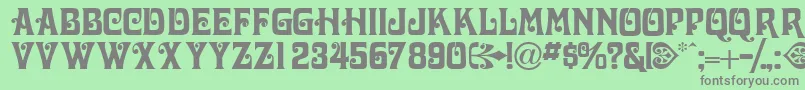 Volutecapsssk Font – Gray Fonts on Green Background