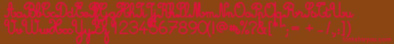 Cursive Standard Bold-fontti – punaiset fontit ruskealla taustalla