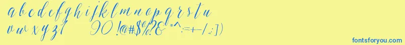 フォントSheilovaScript – 青い文字が黄色の背景にあります。