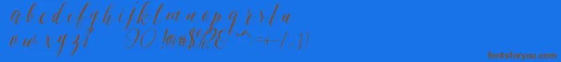 SheilovaScript Font – Brown Fonts on Blue Background