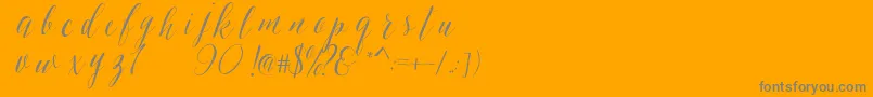 SheilovaScript-Schriftart – Graue Schriften auf orangefarbenem Hintergrund
