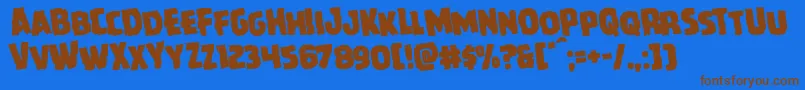 Czcionka Howlinmadrotate – brązowe czcionki na niebieskim tle