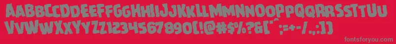 フォントHowlinmadrotate – 赤い背景に灰色の文字