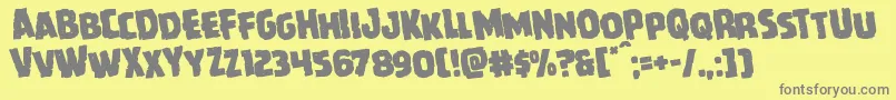 Howlinmadrotate-fontti – harmaat kirjasimet keltaisella taustalla