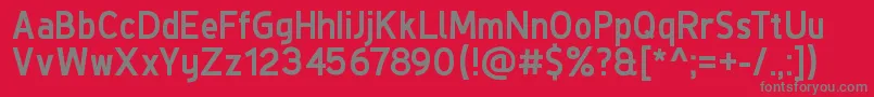 DeLuxeNextBold-fontti – harmaat kirjasimet punaisella taustalla