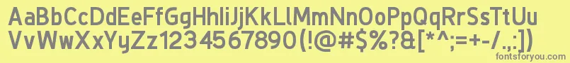 フォントDeLuxeNextBold – 黄色の背景に灰色の文字