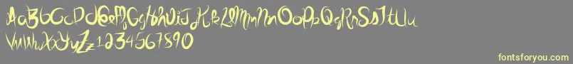 Stolenscript Font – Yellow Fonts on Gray Background