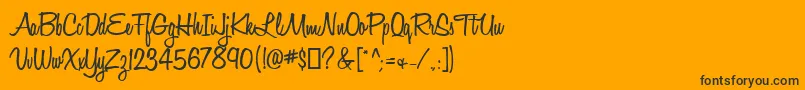 Czcionka HoneyScriptSemibold – czarne czcionki na pomarańczowym tle