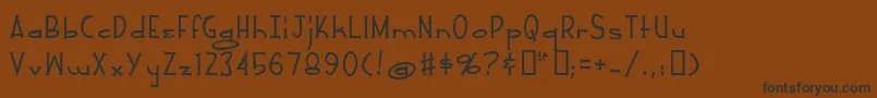 フォントWhiteRussian – 黒い文字が茶色の背景にあります