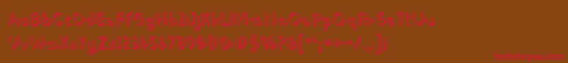 フォントPastern – 赤い文字が茶色の背景にあります。