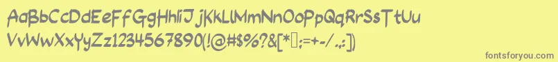 LongAssignment-fontti – harmaat kirjasimet keltaisella taustalla