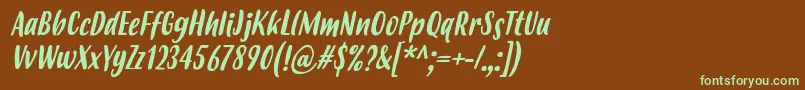 フォントBudidayaItalic – 緑色の文字が茶色の背景にあります。