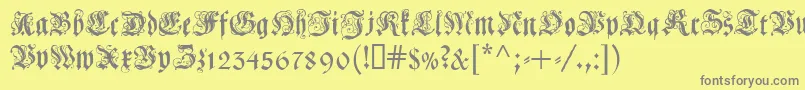 フォントCoelcf – 黄色の背景に灰色の文字