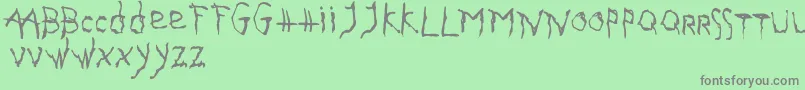 フォントGothika – 緑の背景に灰色の文字