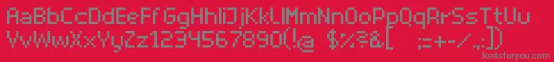 SuperhelioRegular-fontti – harmaat kirjasimet punaisella taustalla