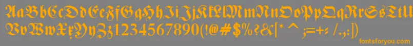 フォントZentenarFrakturBold – オレンジの文字は灰色の背景にあります。
