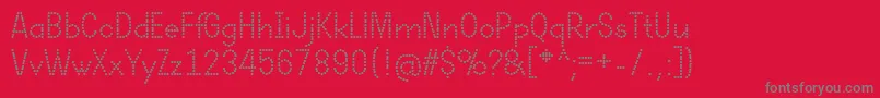 フォントDotcirfulRegular – 赤い背景に灰色の文字