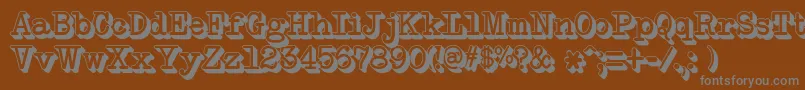 NeobulletinExtruded-fontti – harmaat kirjasimet ruskealla taustalla