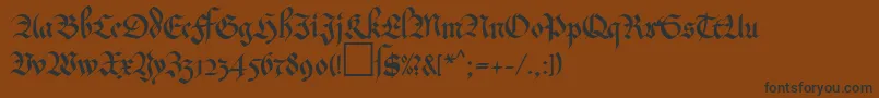 フォントMaGkursiv2Db – 黒い文字が茶色の背景にあります