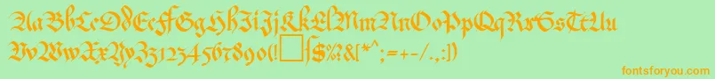 フォントMaGkursiv2Db – オレンジの文字が緑の背景にあります。