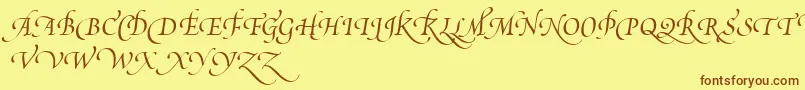 フォントPoeticaSuppSwashCapitalsIii – 茶色の文字が黄色の背景にあります。