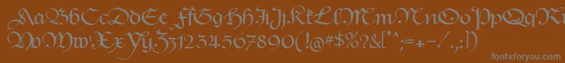 HentimpsCirclet-fontti – harmaat kirjasimet ruskealla taustalla