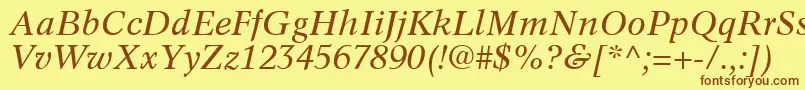 フォントInformaticsSsiItalic – 茶色の文字が黄色の背景にあります。