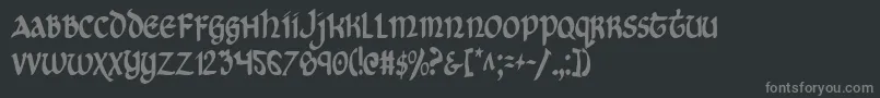 フォントCryUncialCondensed – 黒い背景に灰色の文字